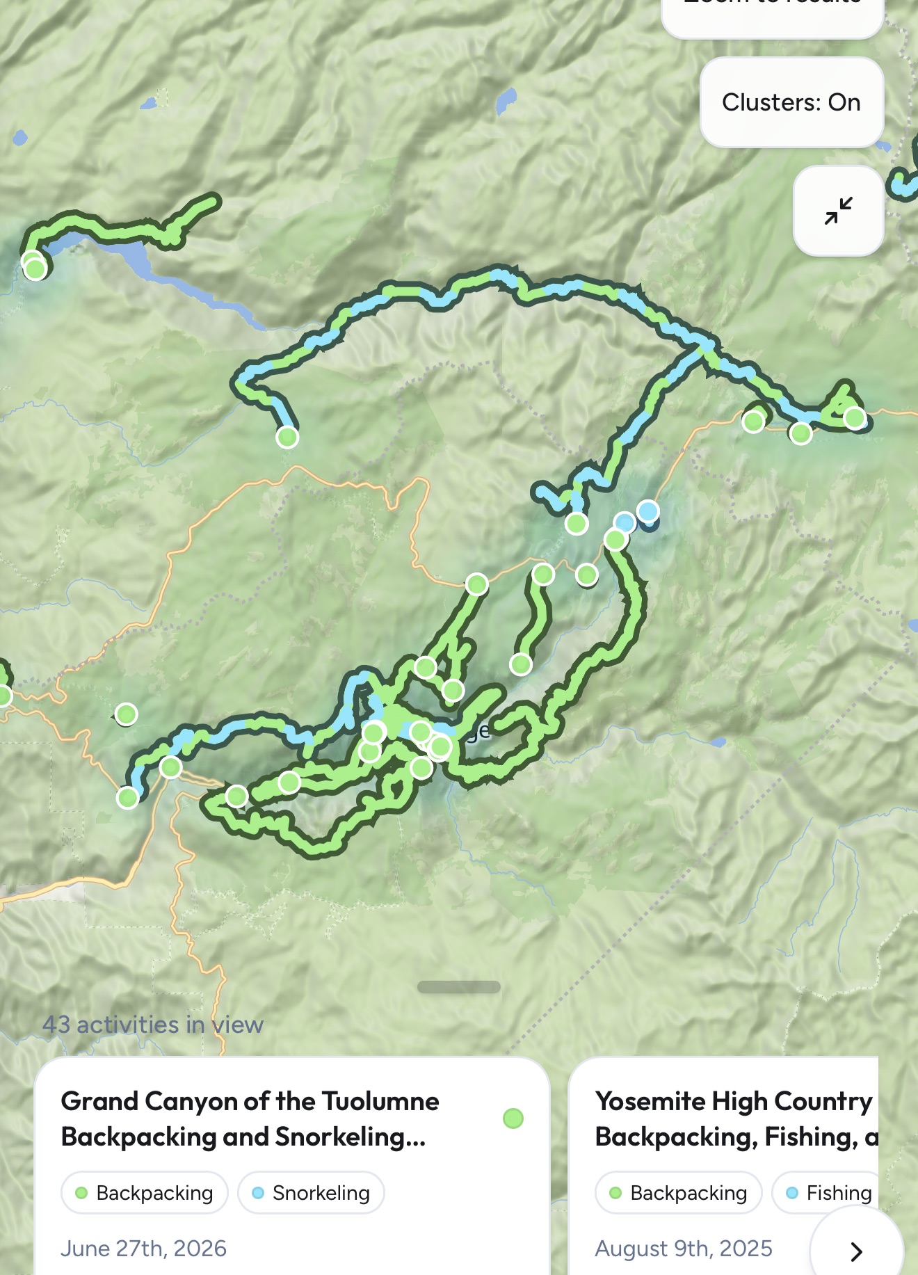 A light terrain map showing many routes, circular start markers, map controls, and a bottom activity-card carousel